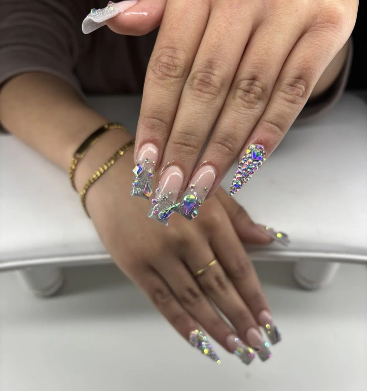 White 3D floral nail art on almond nails