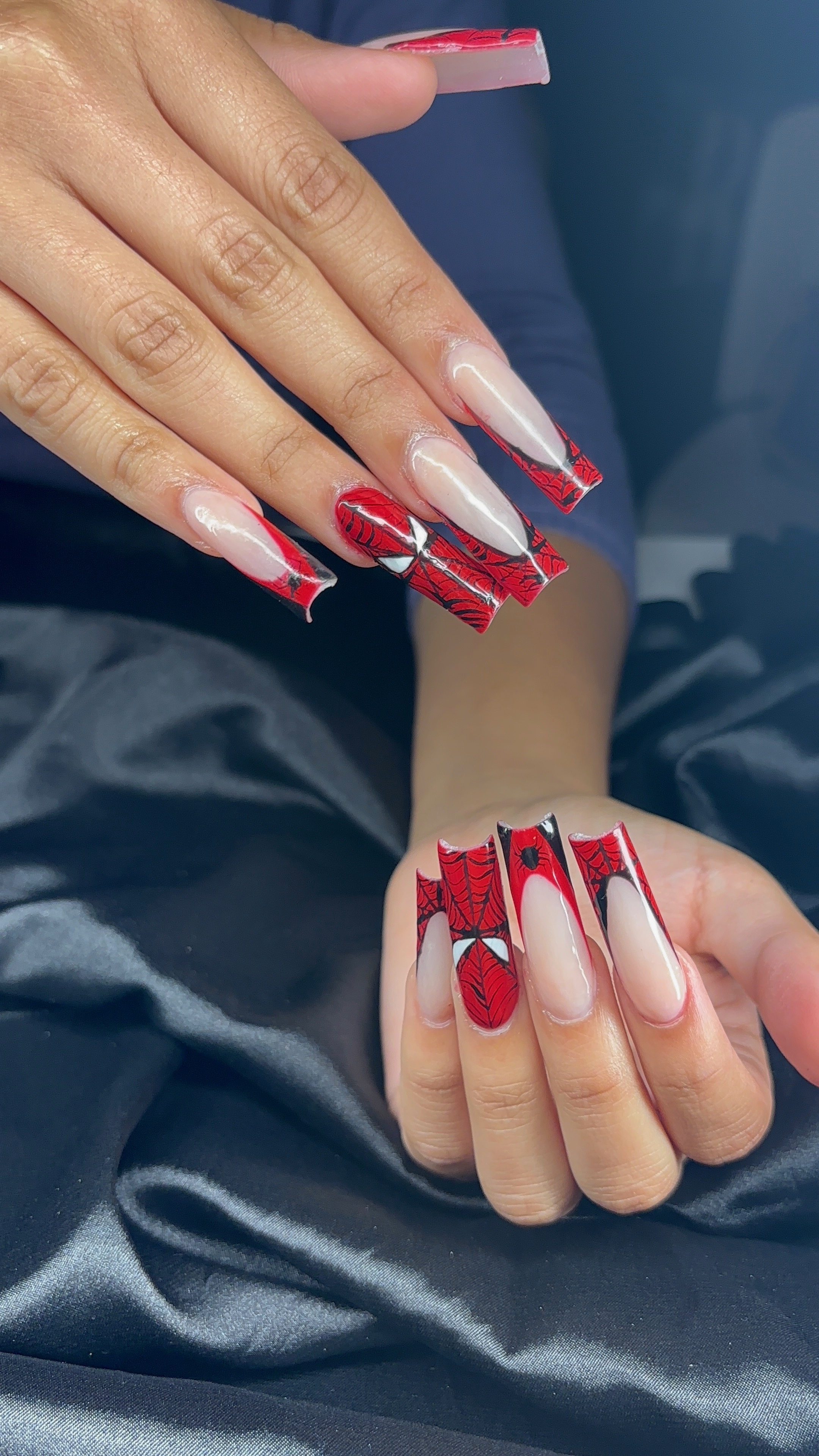 White 3D floral nail art on almond nails