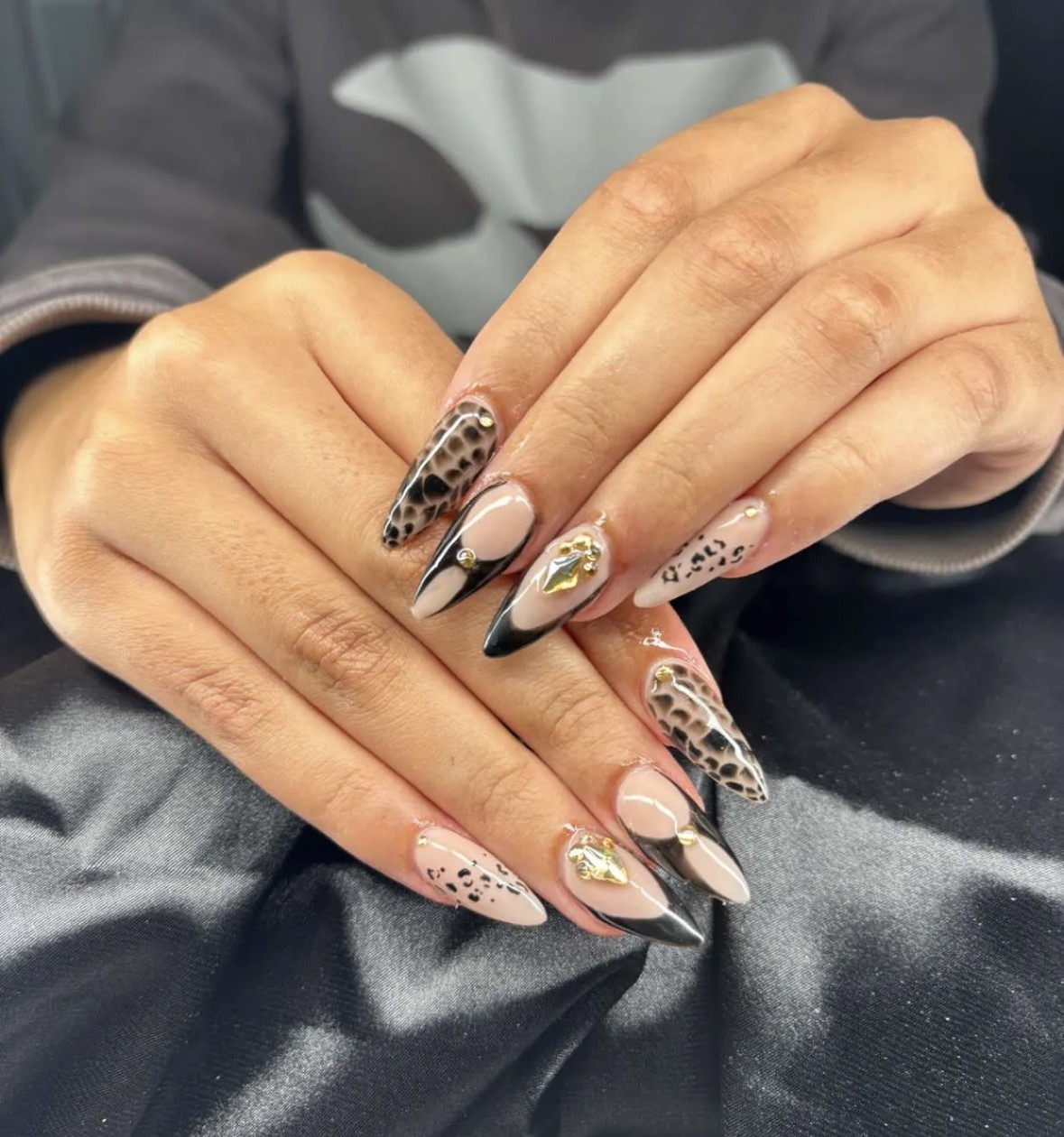 Black chrome and leopard print stiletto nails