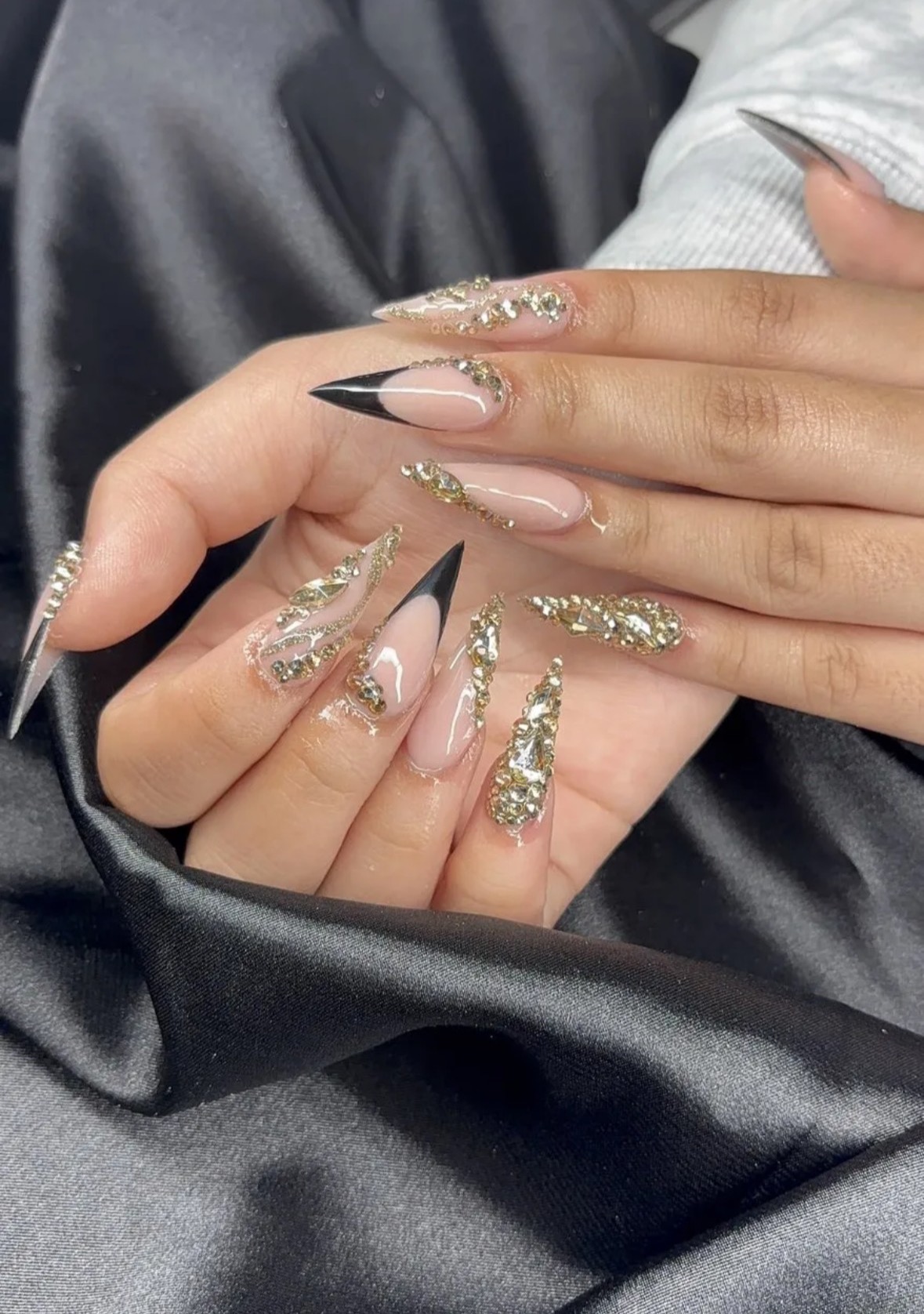 Gold rhinestone stiletto nails by Luxe Nails