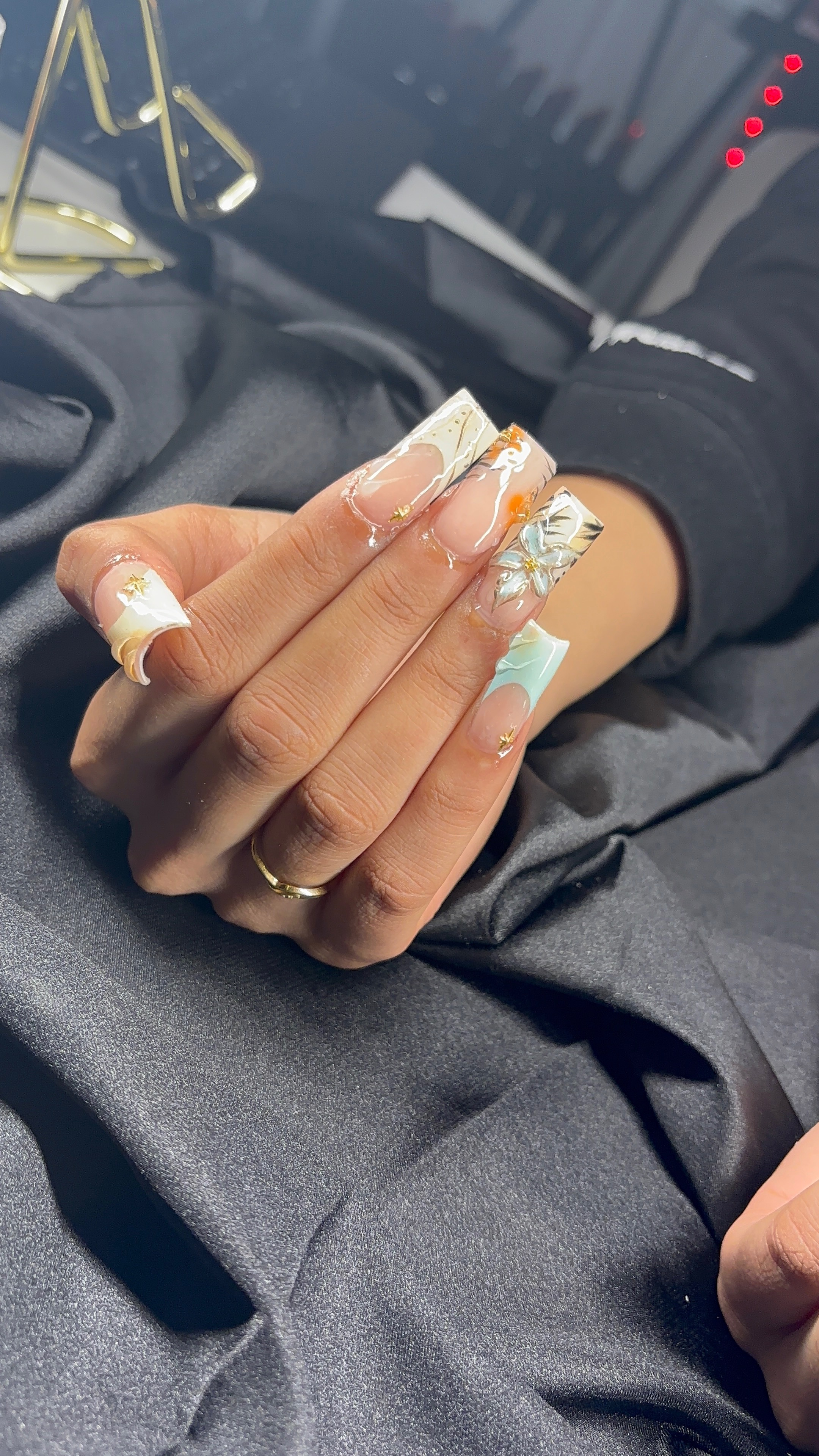 Black bow and pearl stiletto nails by Luxe Nails